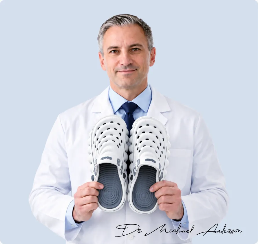Orthopedic specialist holding RESTORE Clogs