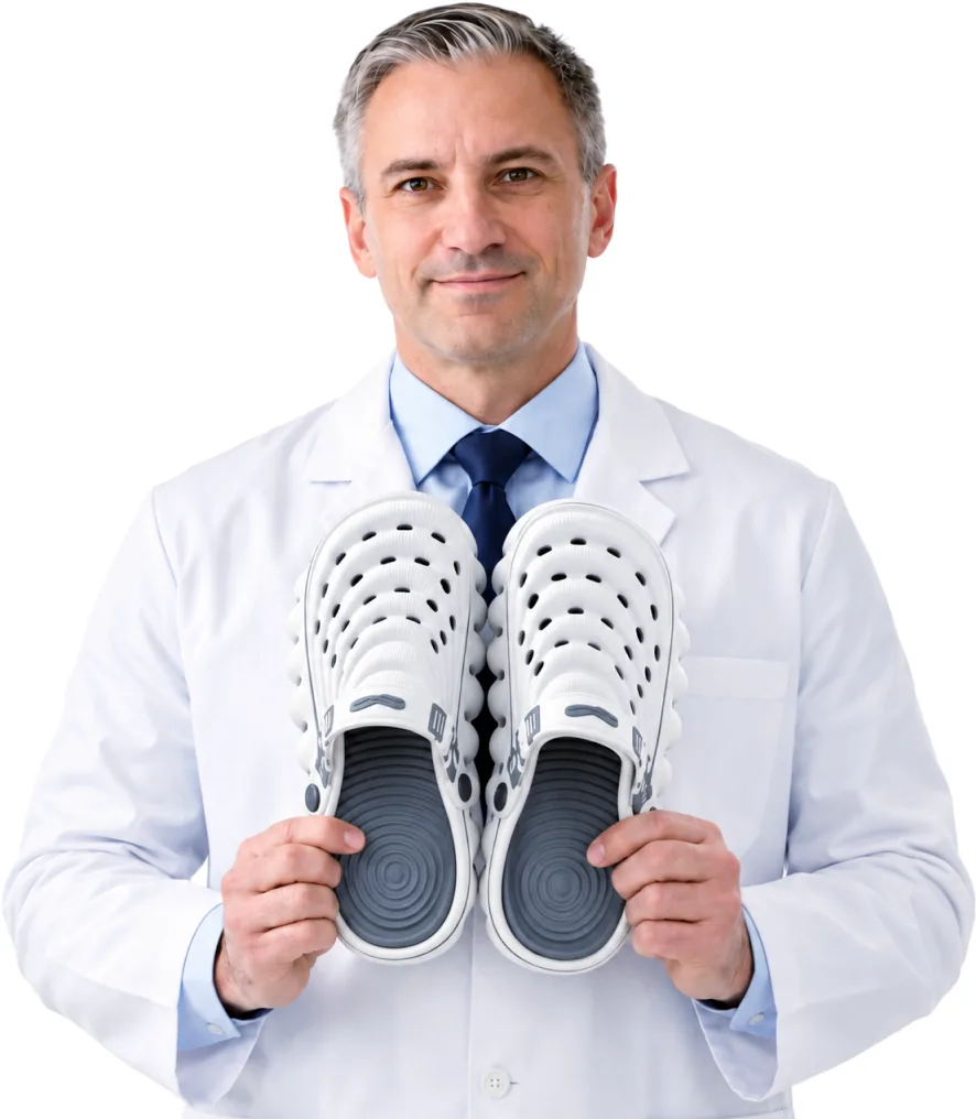 Orthopedic specialist holding a RESTORE Clog